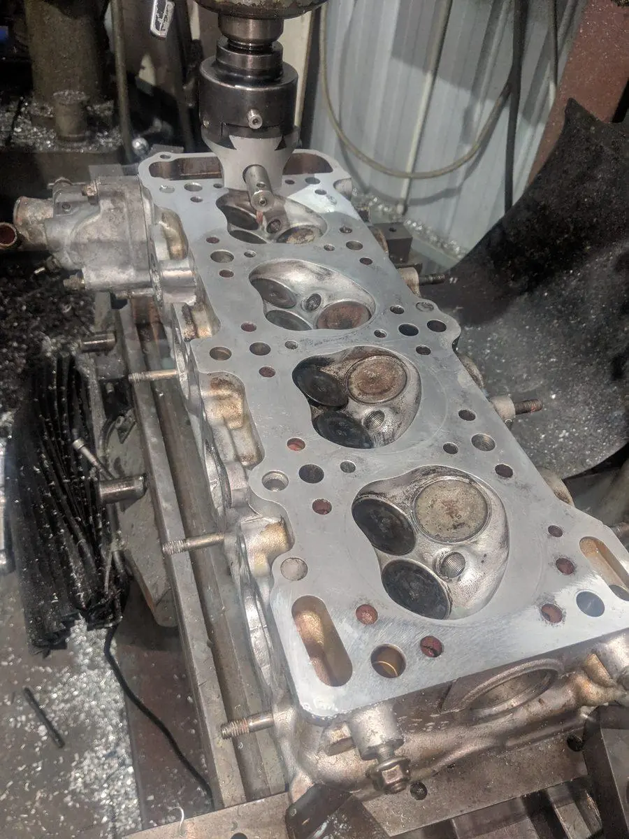 A cylinder head set up on the mill for a repair cut