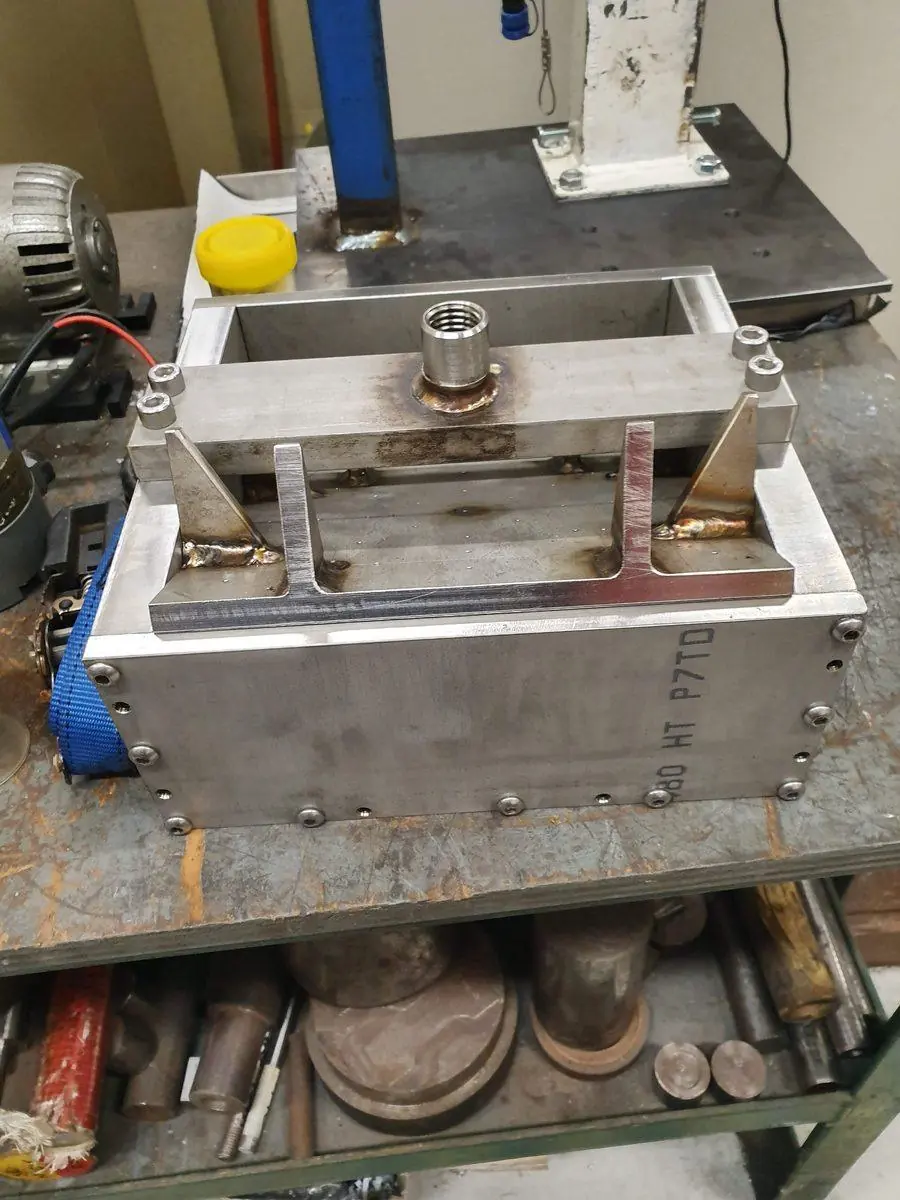 A fabricated tool with machined components fitted into it