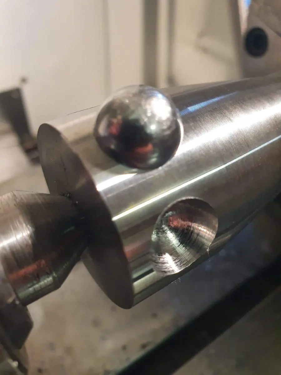 A stainless shaft set up on the lathe