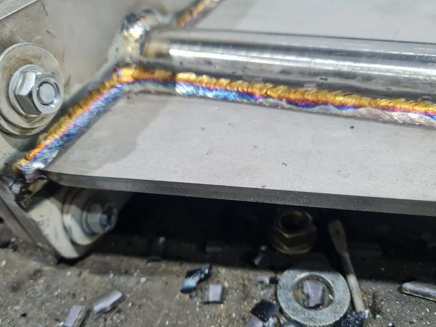 Clean weld runs on an aluminium frame after repair