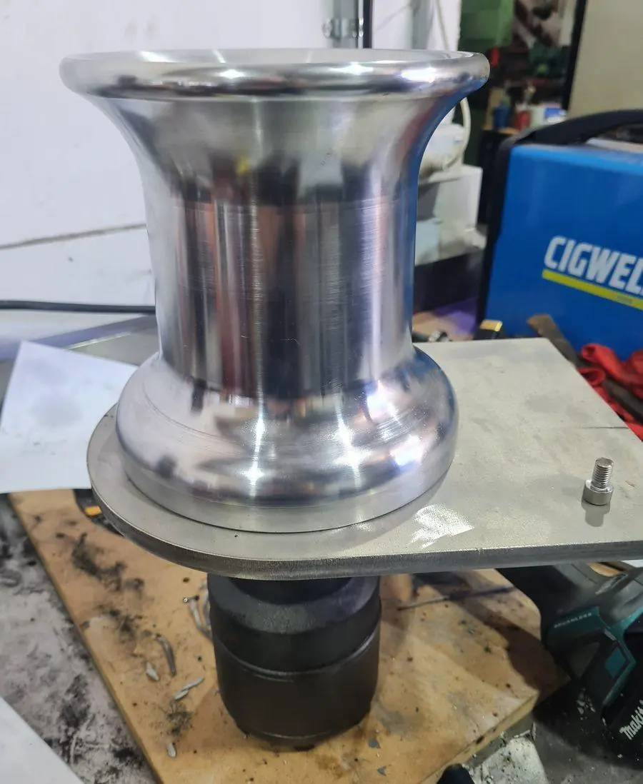 A polished stainless capstan machined in-house