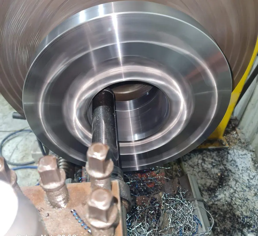 A large disc being machined on the lathe