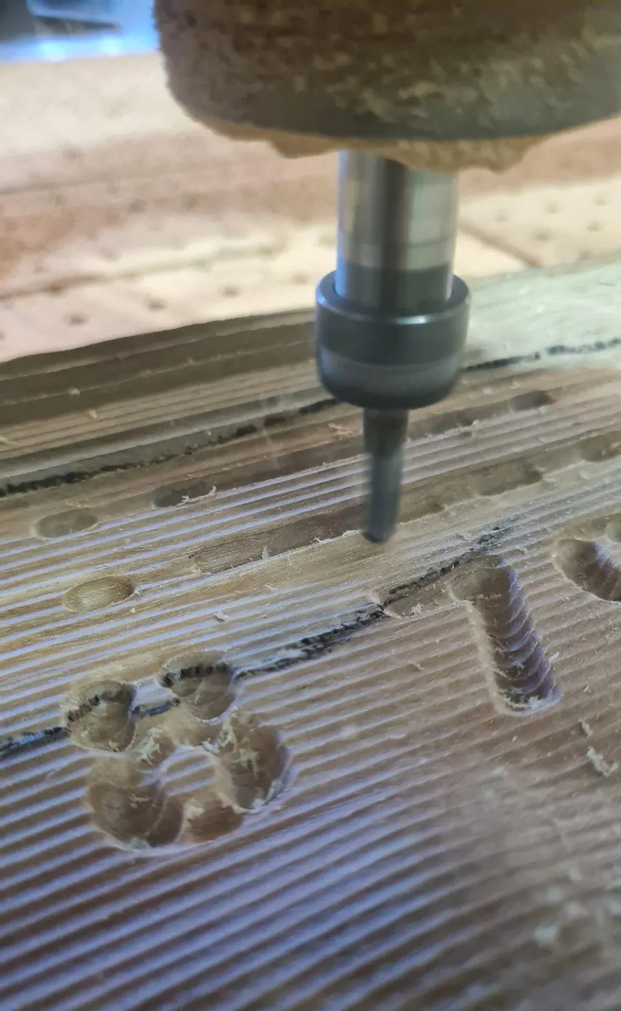 A tapered cutter down in the work during a finishing pass